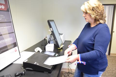 Franklin County Elections Supervisor Gina Kesler demonstrates the state's new voting machine. Early voting is now open, and a special day of early voting will be held Saturday at the elections office in Carnesville.