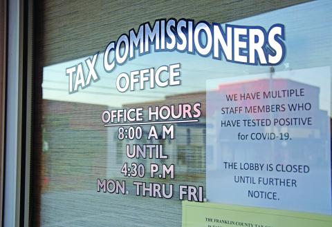 A note on the door of the Franklin County Tax Commissioner’s Office informs taxpayers that the office is closed due to a coronavirus outbreak among staff members. (Photo by Scoggins)