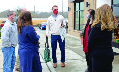 Dr. Clay Hearn (left in right photo) was named the Franklin County Chamber of Commerce’s Citizen of the Year last week, and Chick-Fil-A in Lavonia (above) was named Business of the Year. Chamber officers surprised Hearn and Chick-Fil-A Operator Will Lowe (above, center) with the awards. The chamber’s regular banquet where the awards are traditionally presented had to be cancelled this year due to the coronavirus pandemic.