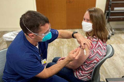 St. Mary's Sacred Heart Hospital Emergency Department nurse practitioner Ruth Tellano Daniel receives one of the first doses of vaccine from Emergency Department Manager Tyler Davison. (Photo courtesy of St. Mary’s Sacred Heart Hospital)