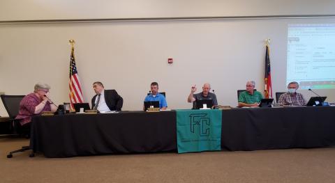 Franklin County Board of Education members Robin Cato (far left) and Randall Gailey (center) voted in favor Tuesday of placing a new Royston Elementary School on Dovetown Road in Royston, but the motion failed after members Alan Mitchell, Kent Hall and Gary Minyard voted against. (Photo by Sinclair)