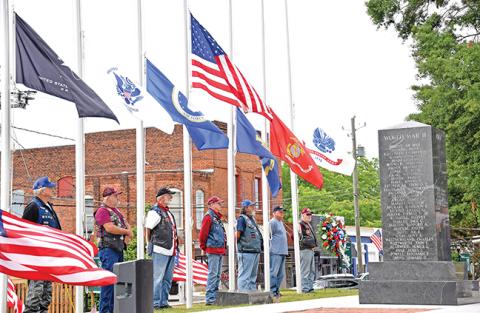 The Memorial Day service was decorated with U.S. flags posted by Richard Roberts of the Patriot Guard Riders, who also participated in the ceremony.