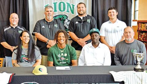 C.J. Blackwell signed a college baseball scholarship recently. A celebration was held for him at Franklin County High School. Pictured are (front, from left) his mother Laura Smith, C.J., his father Corey Blackwell, Franklin County Athletic Director Jason Oliver, (back) Franklin County High School Principal Roger Wilkinson, FCHS Baseball Coach David Skelly and assistant coaches Ryan Phillips and Elliott Beard. (Photo by Scoggins)