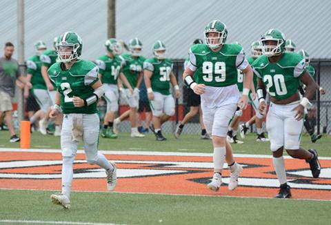 Chris Goode (No. 2), Keylan “Red” Rutledge (No. 99) and Jontavion “Jo Jo” Hughes (No. 20) lead the Franklin County Lions onto the field Saturday at Herndon Stadium for action in the Lake Hartwell Gridiron Classic football jamboree. (Photo by Scoggins)
