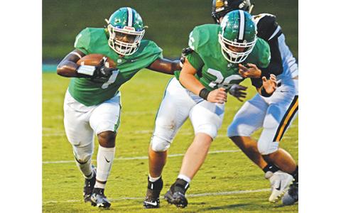 Running back Micah Blackwell runs behind the block of D.J. Seymour during Friday’s win over Crescent, S.C., at Ed Bryant Stadium. Blackwell led Franklin with 147 yards rushing on 23 carries. (Photo by Scoggins)