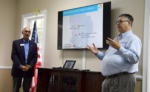 With Moderator Rope Roberts looking on, Development Authority of Walton County Director Shane Short shares that “the golden opportunity” for growth is between the I-20 and I-85 corridors. (Photo by Sinclair)