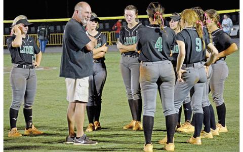 Franklin County Softball Coach Jason Oliver speaks to the eight senior members of his team after the Lady Lions fell in the first round of the state tournament last week to Ringgold in Carnesville. (Photo by Scoggins)