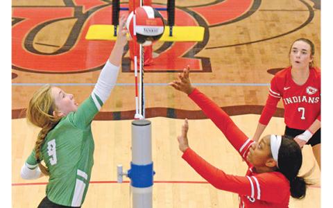 Lady Lion Teague Pierce pokes the ball back over the net in volleyball action against Stephens County last week in the Region 8AAA tournament. (Photo by Scoggins)