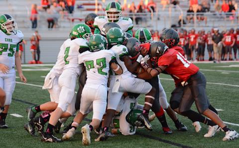 The Franklin County Middle School Cub defense stacks up a Madison ballcarrier during the region championship game Thursday in Danielsville. (Photos by Scoggins)