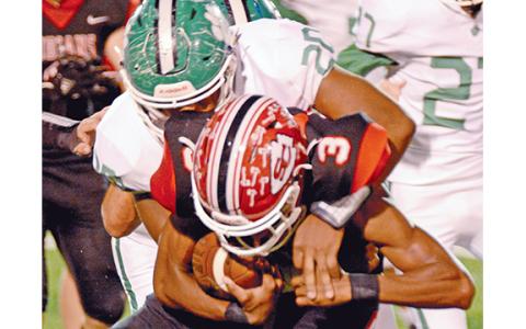 Jo Jo Hughes makes a tackle. (Photo by Rose Scoggins)
