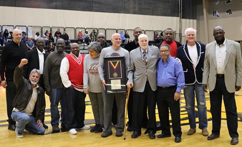 Former Emmanuel College Athletic Director and Head Men’s Basketball Coach Jim Ganey (second from right on front row) was inducted into the college’s Hall of Fame Saturday. He was joined by a host of former players for the event.