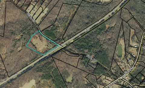 Troy Construction applied to have 15.44 acres at 633 Neal Road rezoned from agriculture intensive to light industrial in order to use the property as storage for the company’s equipment and storage. The property sits along the interstate, but is only accessed by Neal Road.