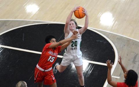 Journey Roberts grabs a rebound. (Photo by Scoggins)