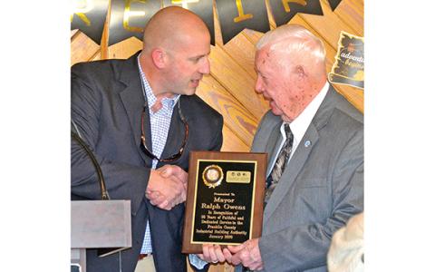 Franklin Springs Mayor Lee Moore (left) presents Ralph Owens a plaque for his 30 years of service on the Industrial Building Authority upon Owens’ retirement as Lavonia mayor in 2019. Owens, who passed away Tuesday, is being remembered as a man who helped better his city and county.