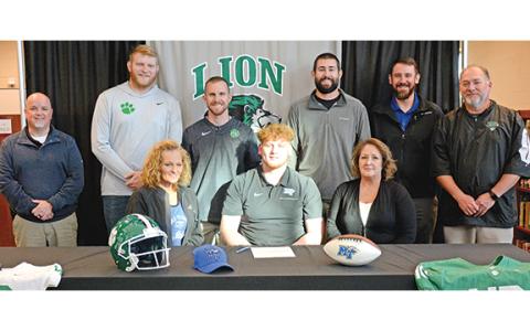 Franklin County High School senior Keylan Rutledge signed a football scholarship last week to play for Middle Tennessee State University. Pictured at his signing ceremony are (front, from left) mom Miranda Rutledge, Keylan, grandmother Juanita McDaniel, (back) FCHS Principal Roger Wilkinson, Coach Charles Folger, Head Football Coach Parker Martin, Coach Bob Brunson, Coach Aaron Campbell and Athletic Director Jason Oliver. (Photo by Scoggins)