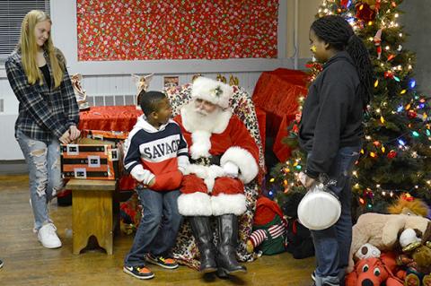 Step of Faith's annual Supper with Santa last week gave children an opportunity to discuss last-minute Christmas wishes with Santa. (Photo by Scoggins)