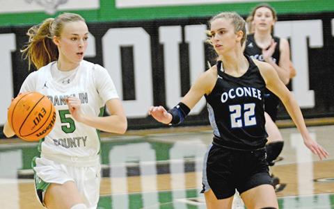 Bailey Aderholdt looks to drive against Oconee County opponents in a game last week in Carnesville. (Photo by Scoggins)