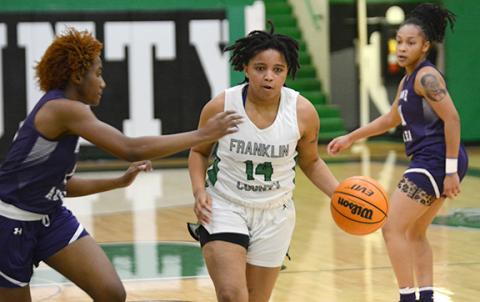 Ny’Kerriah Brown dribbles down court Tuesday in the Lady Lions’ dominant win over Monroe Area. (Photo by Scoggins)