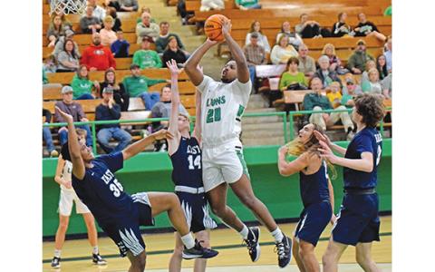 Jontavion “Jo Jo” Hughes goes up for a shot in the midst of four of the five East Jackson Eagles on the floor during Tuesday’s 63-34 Franklin County victory. (Photo by Scoggins)