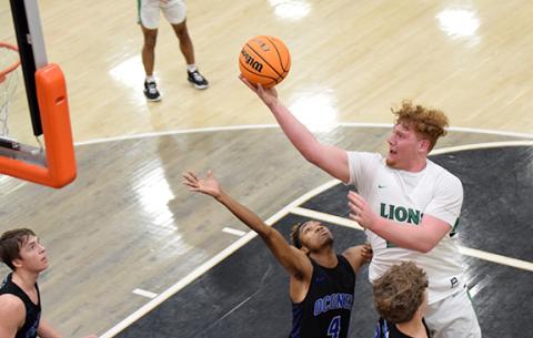 Keylan “Red” Rutledge lays in two of his 27 points in the region semifinal game Thursday against Oconee County in Hartwell. (Photo by Scoggins)