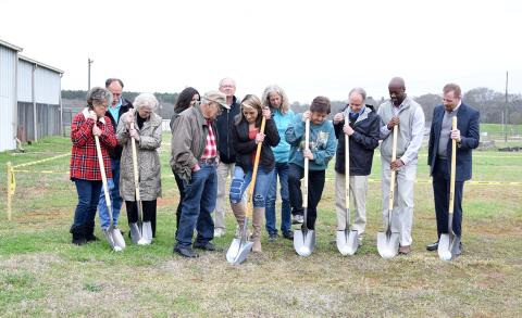 Northeast Georgia Animal Shelter board members, staff and supporters celebrate the groundbreaking for its new building Thursday afternoon. (Photo by Sinclair)
