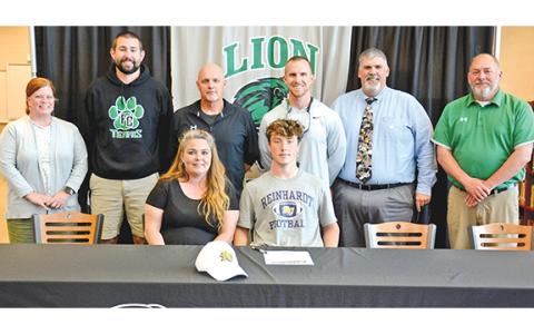 Participating in a signing ceremony for Chris Goode Monday at Franklin County High School were (front) mom Terrie, Chris, (back) FCHS Assistant Principal Natalie Erskine, Coach Bob Brunson, former FCHS Football Coach Paul Sutherland, FCHS Head Coach Parker Martin, Coach David Skelly and Athletic Director Jason Oliver. (Photo by Scoggins)