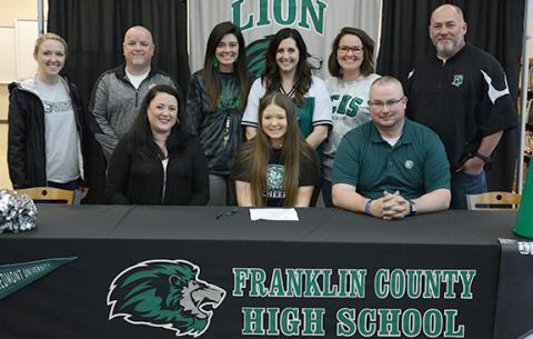 Among those joining Gracie Davis at her signing ceremony Friday were (front, from left) mom Marie, Gracie, dad Jeremy, (back) Piedmont University Cheer Coach Cristen Rabern, FCHS Principal Roger Wilkinson, Allie Shubert, FCHS Competition Cheer Coach Megan Jackson, FCHS Sideline Cheer Coach Allie Bohannon and Athletic Director Jason Oliver. (Photo by Scoggins)