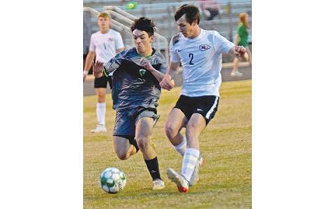 Jaden Willette, who had a goal Tuesday against Stephens County, battles for a ball against an Indians defender. (Photo by Scoggins)