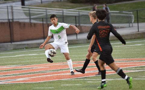Francisco Guadarrama takes the ball down the field. (Photo by Scoggins)
