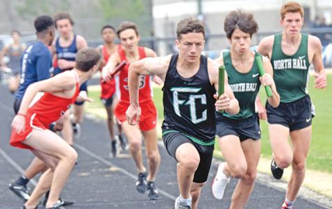 Ben Hardman takes off on his leg of the distance medley  relay Saturday at the 12th annual Eagle Invitational at East Jackson High School in Commerce. Hardman and the Lions finished fourth. (Photo by Scoggins)