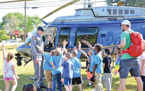 Students in Tyler Matthews' kindergarten class at Lavonia Elementary School are given a lesson Friday on helicopters by members of the Georgia State Patrol helicopter team. (Photo by Scoggins)