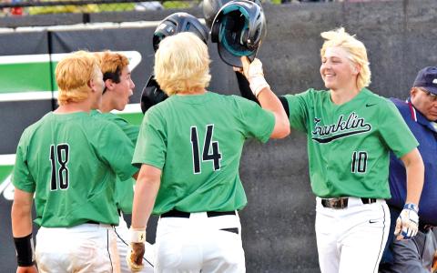 Celebrating a blond bomb: Lawson Gailey (left) crosses home plate after hitting a home run last week in the Franklin County High School baseball team’s first-round state playoff victory over Coahulla Creek. Teammates Ty Peeples, A.J. Peeples and Kayne Jinks await him to celebrate. The baseball team bleached their hair before the playoff games begin. (Photo by Scoggins)
