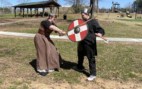 Rebecca Howard and Colton Bradford act out a fight scene in Viking dress. The Vikings will be the theme for the Lavonia Renaissance Festival that will be held Saturday at the Lavonia Memorial Park. (Photo courtesy of Andrea Bradford)