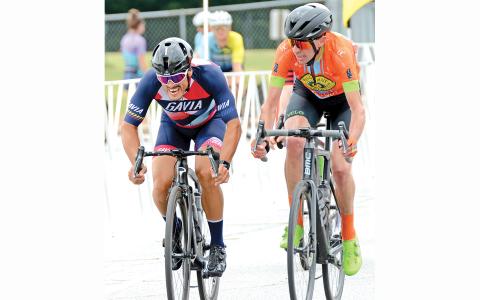 Two bicyclers race to the finish Sunday in the Tour of North Georgia stop at Franklin County High School (Photo by Scoggins)