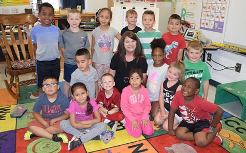 Candace Oliver sits with her last kindergarten class. (Photo by Sinclair)