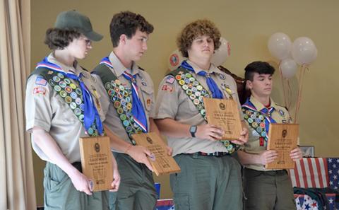 Scout Troop No. 51 members (clockwise from top left) Connor McDuffie, Jaden Willette, J.T. Strickland and Duncan McDuffie received their Eagle Scout awards during a ceremony May 21 at Lavonia First United Methodist Church. (Photos by Scoggins)