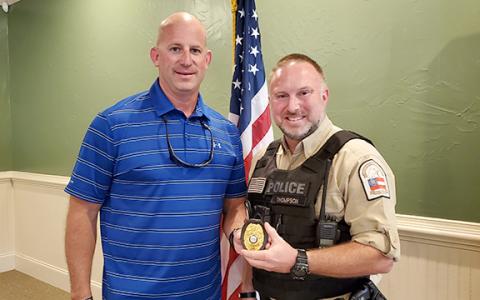 Mayor Lee Moore presents Kevin Thompson with the Franklin Springs Police Chief badge at Thursday’s meeting. (Photo by Sinclair)