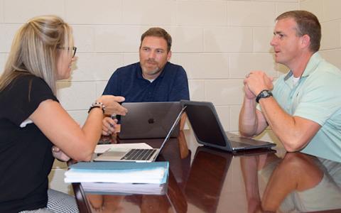 Franklin County Middle School Assistant Principal Kasey Haley, Principal Jason Swiney and Assistant Principal David Cawthon discuss ideas for a better learning experience. (Photo by Sinclair)