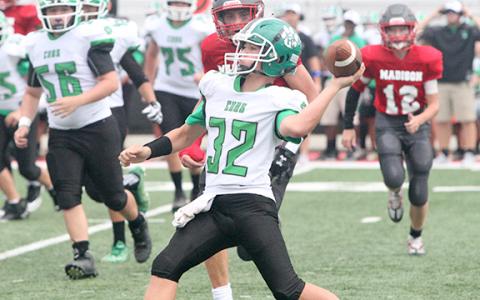 Quarterback Elliott Harbin prepares to throw a pass in FCMS’s victory last week over Madison County in Danielsville. (Photo courtesy of Zach Mitchum at The Madison County Journal)