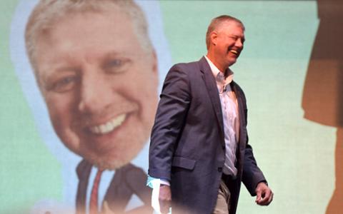 Pioneer RESA Executive Director Justin Old laughs during his speech at Franklin County Schools' Convocation ceremony Monday. (Photo by Scoggins)