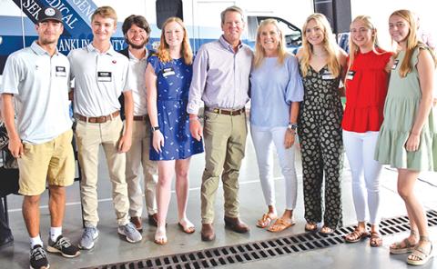 Georgia Gov. Brian Kemp and First Lady Marty Kemp took photos with students who helped with a campaign event Thursday in Franklin Springs. Pictured are (from left) Dee Oliver, Jack Gaines, Grayson Cobb, Hannah Justice, Gov. and First Lady Kemp, Sarah Justice, Rylee Moore and Macy Moore. (Photo by Scoggins)