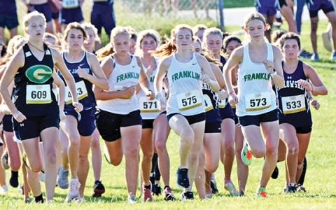 Lady Lions (from left) Kadyn Crowe, Jocelyn Dean (No. 571), Abigail Howie (No. 575) and Megan Hightower (No. 573) take off during the start of the girls’ varsity race at the Jefferson meet. (Photo by Scoggins)