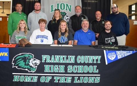 Surrounded by coaches and family, Journey Roberts signs with the University of North Georgia Nighthawks Nov. 9. (Photo by Sinclair)
