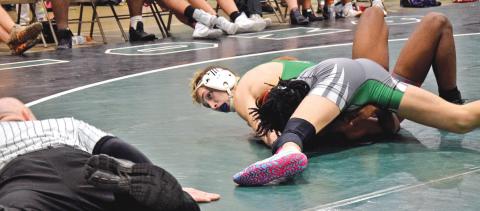 Lion Hunter Page looks to the referee for a pin in a victory over a Stephens County opponent Tuesday in the Coliseum in Carnesville. (Photo by Scoggins)