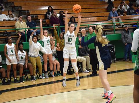 Calin Baird puts up a three-point shot against Seneca, S.C., as her teammates  show they expect it to go in. Baird, Journey Roberts, Lay Lay Sturghill and Paris Gaye will be honored Tuesday during Senior Night. (Photo by Scoggins)