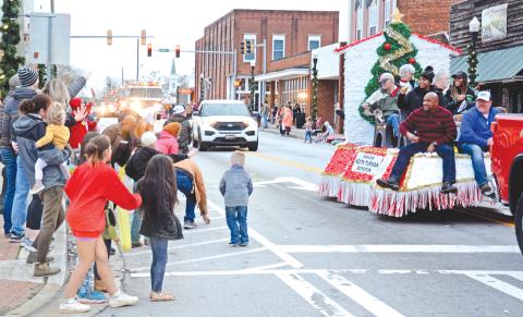 ROYSTON – There were plenty of smiles, waves and candy Saturday evening during the Royston Christmas Parade. Citizens lined the parade route to celebrate the season and watch the parade of emergency vehicles, floats and assorted vehicles. For more photos, see Page 16. (Photos by Scoggins)