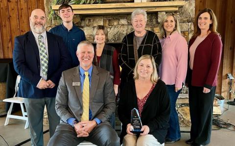 The late Chris Forrer's family and members of the Franklin County School System attended an awards ceremony last week where Forrer was posthumously awarded the Pioneer in Education Award by Pioneer RESA.