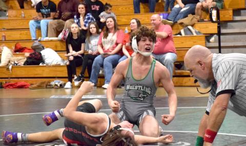 Lion Kenly Eavenson celebrates after pinning his Lakeview-Fort Oglethorpe opponent Saturday in the state sectionals hosted by Franklin County at the Coliseum on Busha Road. (Photo by Scoggins)