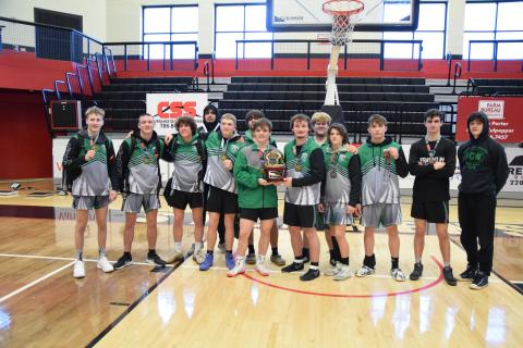 The Franklin County Lion wrestling team celebrate after receiving their Area 8AAA traditional team championship. (Photo by Scoggins)