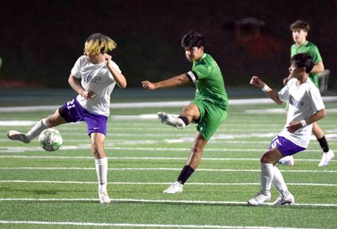 Omar Guadarrama launches a kick that found the net for a goal Tuesday against Monroe Area. (Photos by Scoggins)
